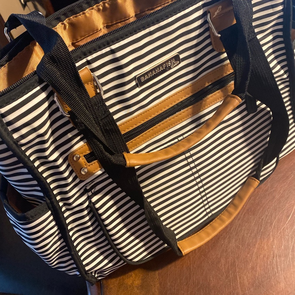Black and White Striped Travel Bag with Leather Accents